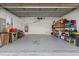 Spacious garage with ample storage shelving and room for vehicles and equipment at 4077 La Costa Island Ct, Punta Gorda, FL 33950