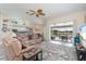 Living room opens to a screened patio overlooking the pool at 4077 La Costa Island Ct, Punta Gorda, FL 33950