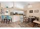 Bright kitchen with white cabinets, breakfast bar, and dining area at 4077 La Costa Island Ct, Punta Gorda, FL 33950