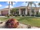 Single-story home with a two-car garage and well-manicured lawn at 4077 La Costa Island Ct, Punta Gorda, FL 33950