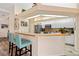 Kitchen features a breakfast bar and white cabinets at 4077 La Costa Island Ct, Punta Gorda, FL 33950
