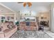 Spacious living room with a comfortable sofa and view of the pool at 4077 La Costa Island Ct, Punta Gorda, FL 33950