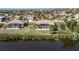 Two houses with screened pools and large lots overlooking a canal at 4077 La Costa Island Ct, Punta Gorda, FL 33950
