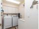 Laundry room with washer, dryer, and utility sink at 4077 La Costa Island Ct, Punta Gorda, FL 33950