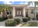 Double-door entry with columns and lush landscaping at 4077 La Costa Island Ct, Punta Gorda, FL 33950