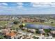 Aerial view of house on golf course with lake views at 4077 La Costa Island Ct, Punta Gorda, FL 33950