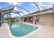 Inviting screened-in pool with a spacious patio at 4077 La Costa Island Ct, Punta Gorda, FL 33950