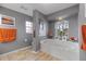 Elegant bathroom with a large soaking tub and gray walls at 4077 La Costa Island Ct, Punta Gorda, FL 33950