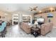 Spacious living room with lake view and wood-look tile at 4077 La Costa Island Ct, Punta Gorda, FL 33950
