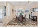 Elegant dining area with a glass table and chandelier at 4077 La Costa Island Ct, Punta Gorda, FL 33950