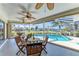 Enjoy the screened-in pool area with seating and water views at 1111 La Salina Ct, Punta Gorda, FL 33950