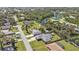 Aerial view showcasing a single-Gathering home with a pool and a canal nearby at 1489 Kensington St, Port Charlotte, FL 33952