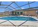 Inviting pool area with screened enclosure at 1489 Kensington St, Port Charlotte, FL 33952