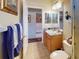 Guest bathroom with single vanity and toilet at 5291 Laurel Oak Ct, North Port, FL 34287