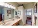 Main bathroom with double vanity and large walk-in shower at 5291 Laurel Oak Ct, North Port, FL 34287