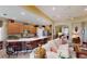 Open concept kitchen with breakfast bar, stainless steel appliances, and views to living room at 5291 Laurel Oak Ct, North Port, FL 34287