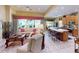 Open living room and kitchen with island and stainless steel appliances at 5291 Laurel Oak Ct, North Port, FL 34287