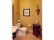 Small powder room with decorative accents and tiled floor at 5291 Laurel Oak Ct, North Port, FL 34287