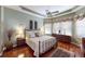 Main bedroom with bay window and ornate wooden dresser at 5291 Laurel Oak Ct, North Port, FL 34287