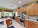Bright kitchen with stainless steel appliances and light wood cabinets at 5291 Laurel Oak Ct, North Port, FL 34287