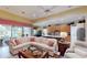 Spacious living room with open floor plan and access to backyard patio at 5291 Laurel Oak Ct, North Port, FL 34287