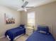 Guest bedroom with twin beds and window shutters at 5291 Laurel Oak Ct, North Port, FL 34287