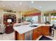 Spacious kitchen with granite countertops, stainless steel appliances, and an island at 5291 Laurel Oak Ct, North Port, FL 34287