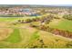 Aerial view of golf course community with homes and waterways at 5291 Laurel Oak Ct, North Port, FL 34287