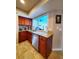 Kitchen with granite counters, stainless steel appliances, and view of patio at 509 Clearview Dr, Port Charlotte, FL 33953