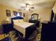 Cozy bedroom with a queen-size bed, nightstands, and a ceiling fan at 509 Clearview Dr, Port Charlotte, FL 33953