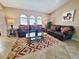 Spacious living room with leather sofas and an area rug at 509 Clearview Dr, Port Charlotte, FL 33953