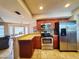 Kitchen boasts stainless steel appliances and granite countertops at 509 Clearview Dr, Port Charlotte, FL 33953
