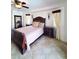 Elegant main bedroom with a king-size bed and dark wood furniture at 509 Clearview Dr, Port Charlotte, FL 33953