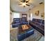 Relaxing living room features leather sofas and a large TV at 509 Clearview Dr, Port Charlotte, FL 33953