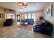 Spacious living room featuring leather sofas and a large area rug at 509 Clearview Dr, Port Charlotte, FL 33953