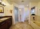 Clean bathroom with granite countertops, a shower, and a bathtub at 509 Clearview Dr, Port Charlotte, FL 33953