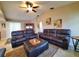 Spacious living room featuring two leather reclining sofas and a large ottoman at 509 Clearview Dr, Port Charlotte, FL 33953