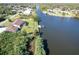 Aerial view showcasing canal front property with lush landscaping at 509 Clearview Dr, Port Charlotte, FL 33953