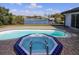 Octagon spa and kidney-shaped pool with water views at 509 Clearview Dr, Port Charlotte, FL 33953