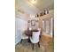 Elegant dining room with round table and four white chairs at 509 Clearview Dr, Port Charlotte, FL 33953