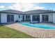 Relaxing backyard oasis with a pool, spa, and patio at 509 Clearview Dr, Port Charlotte, FL 33953
