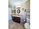 Updated bathroom with granite vanity, tiled floors and shower at 509 Clearview Dr, Port Charlotte, FL 33953