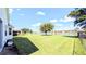 Large backyard with pond view and privacy fence at 24025 Canal St, Punta Gorda, FL 33980