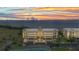 Stunning sunset aerial view of the waterfront condo and surrounding water at 101 N Marion Ct # 122, Punta Gorda, FL 33950