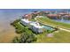 Scenic waterfront condos boast a community pool, tennis courts, and beautifully maintained landscaping at 101 N Marion Ct # 122, Punta Gorda, FL 33950