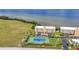 Aerial view of a waterfront condominium featuring a tennis court and scenic ocean views at 101 N Marion Ct # 122, Punta Gorda, FL 33950
