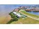 Beautiful waterfront condo featuring a tennis court, lush landscaping, and scenic community views at 101 N Marion Ct # 122, Punta Gorda, FL 33950