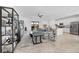 Open concept living room with sectional sofa, large TV and built-in shelving at 14640 Sycamore Ct # 2822, Punta Gorda, FL 33955