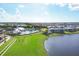 Resort-style pool, tennis courts, and clubhouse at 14640 Sycamore Ct # 2822, Punta Gorda, FL 33955