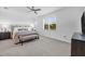 Spacious main bedroom with large window and ceiling fan at 14640 Sycamore Ct # 2822, Punta Gorda, FL 33955